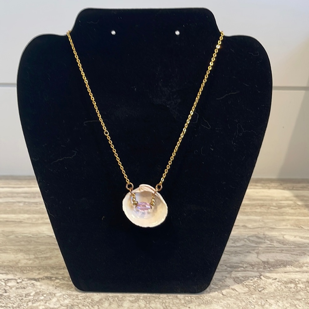 Handmade Necklace with Clam Seashell with purple crystal and gold beads.